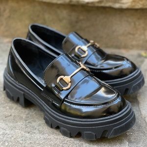 Black lug sole loafers